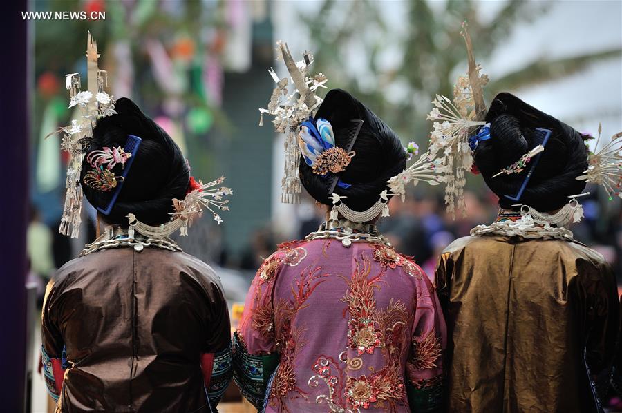 Miao women dress up to celebrate Spring Festival